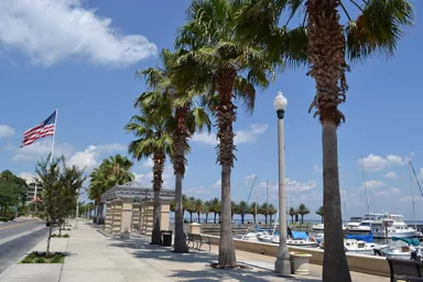 Palm-lined waterfront promenade at Sanford RiverWalk