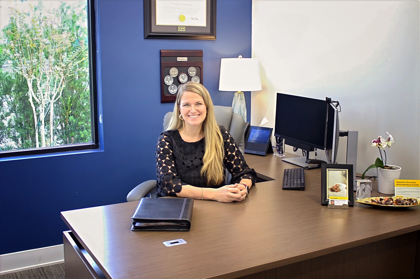 Madison Hill seated at her Edward Jones office