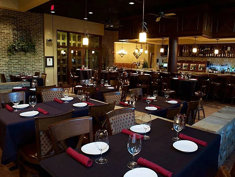 Dining tables and the wine bar inside The Vineyard Wine Company
